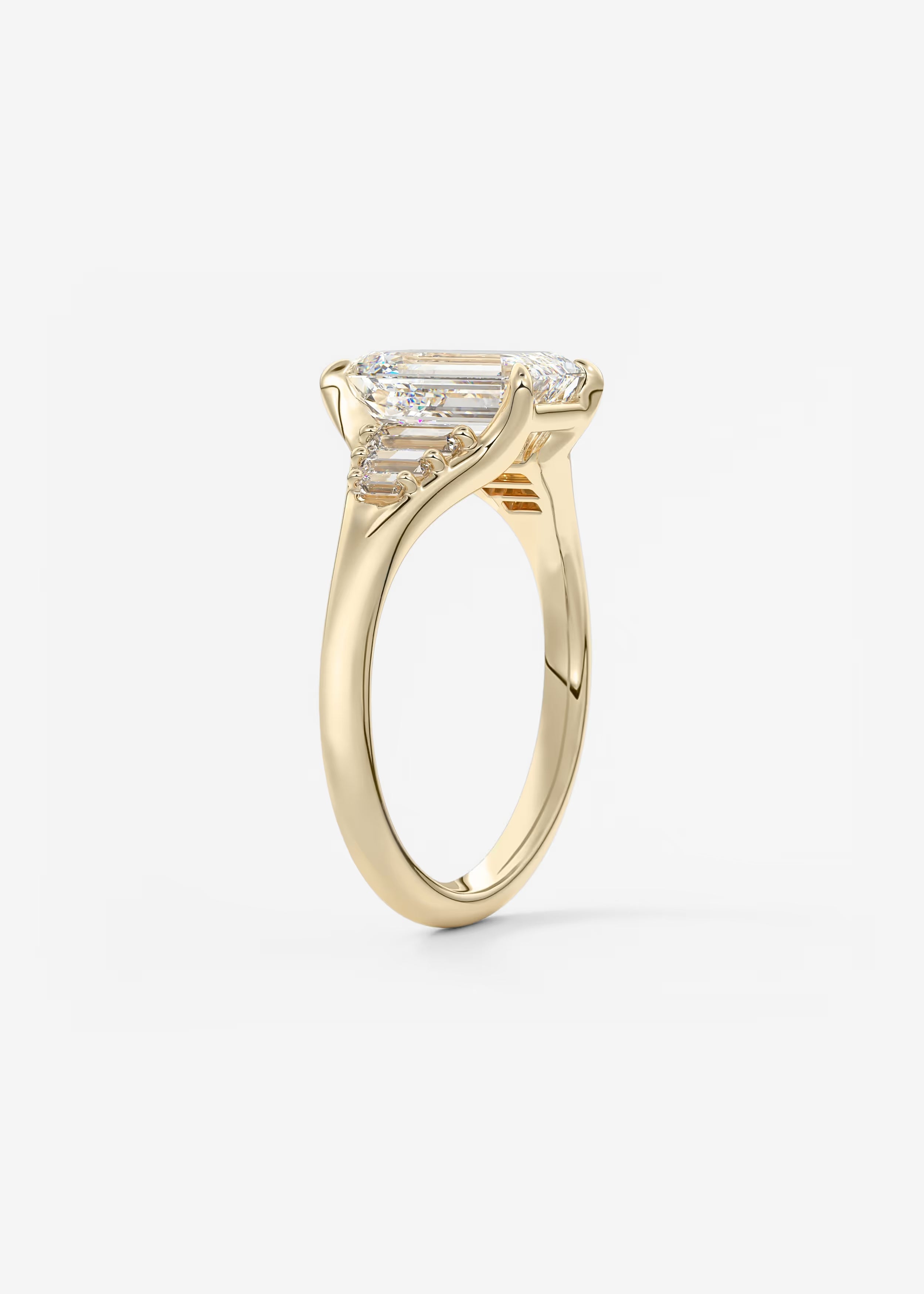 Emerald & Baguette Three Stone Split Shank Engagement Ring