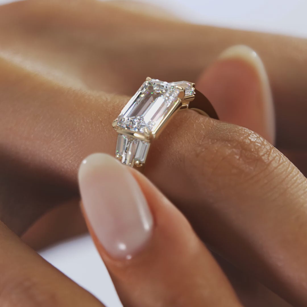 East West Emerald Cut Seven Stone Engagement Ring with Baguette Diamond Accents
